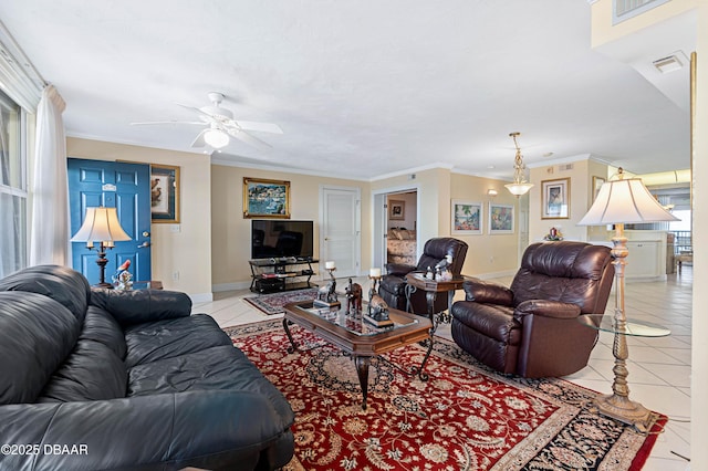 living area with ornamental molding, visible vents, baseboards, and light tile patterned floors