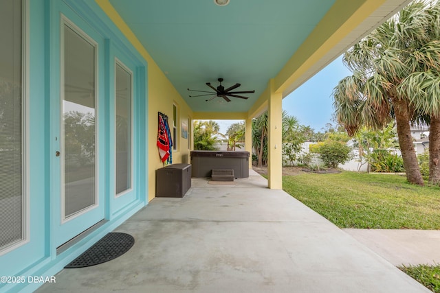 view of patio featuring a hot tub and ceiling fan