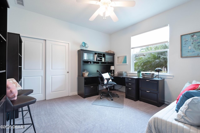 office space with ceiling fan and light colored carpet