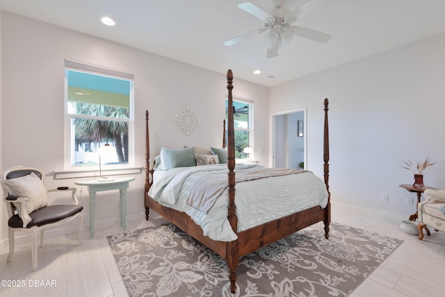 bedroom featuring multiple windows and ceiling fan