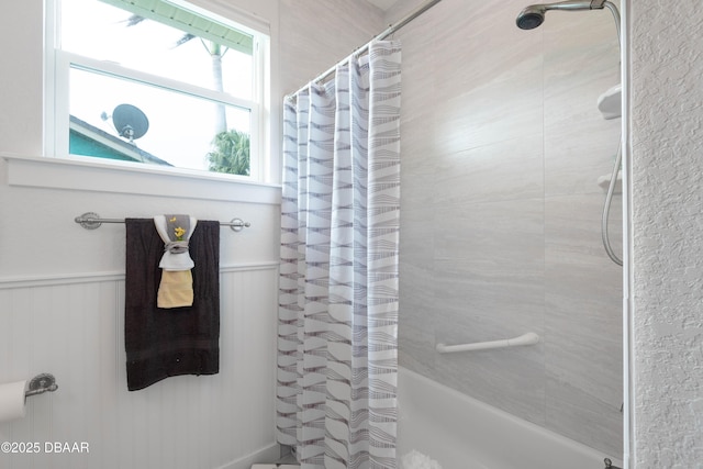 bathroom featuring shower / tub combo with curtain