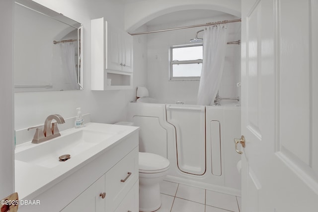 full bathroom with tile patterned floors, toilet, vanity, and shower / bathtub combination with curtain