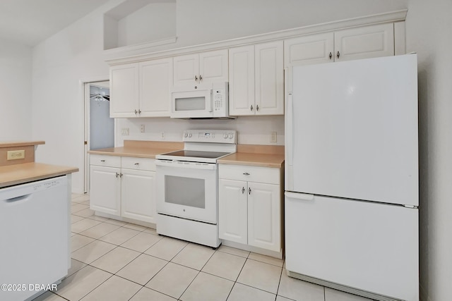 kitchen featuring white cabinets, white appliances, and light countertops