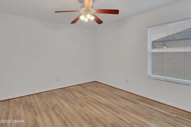 empty room with light wood-style floors, baseboards, and ceiling fan
