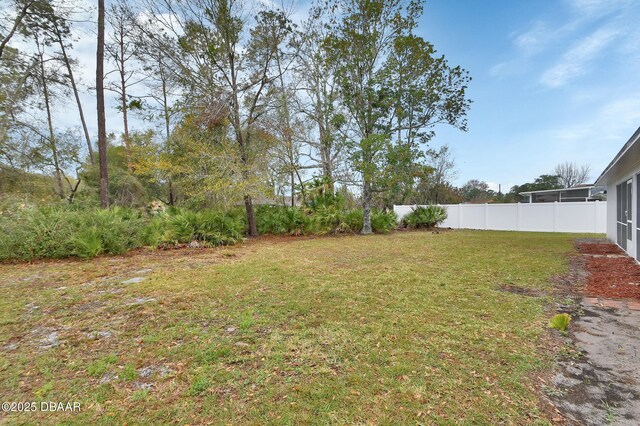 view of yard featuring fence