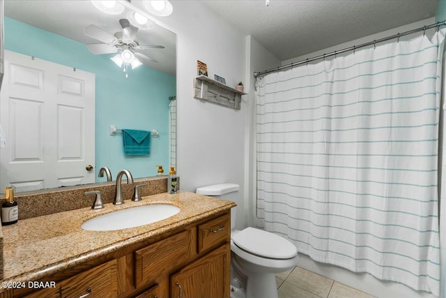 bathroom with walk in shower, tile patterned flooring, a textured ceiling, toilet, and vanity