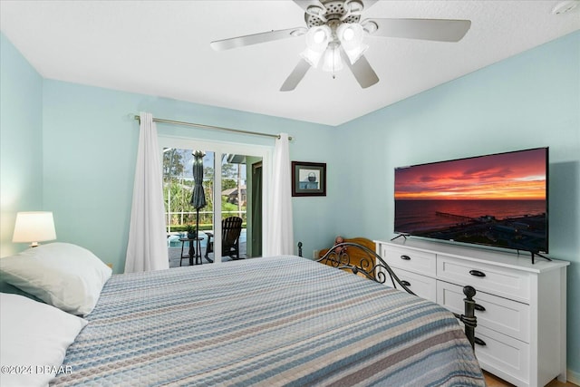 bedroom with access to exterior and ceiling fan