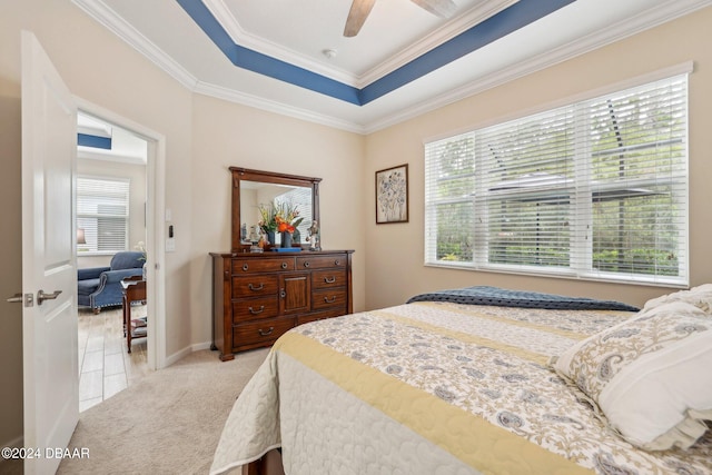 bedroom featuring light carpet, ceiling fan, and crown molding