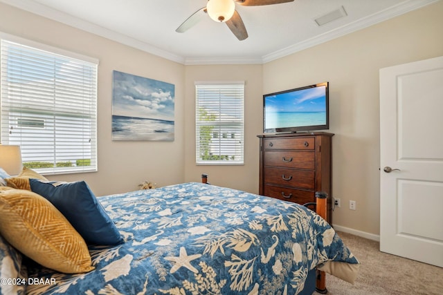 carpeted bedroom with ornamental molding, multiple windows, and ceiling fan