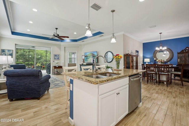 kitchen with dishwasher, sink, an island with sink, white cabinetry, and light hardwood / wood-style flooring