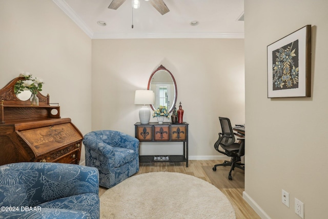 office area featuring ornamental molding, light hardwood / wood-style flooring, and ceiling fan