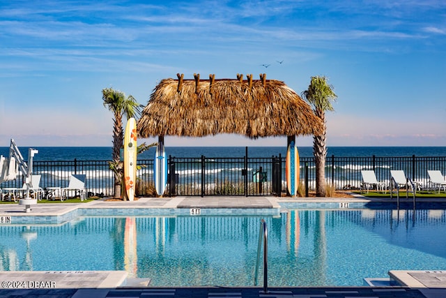 view of pool with a water view and a gazebo