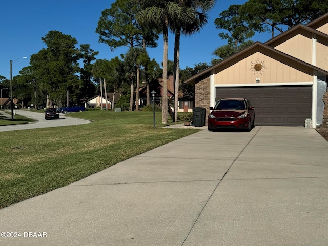 view of home's exterior featuring a yard and a garage