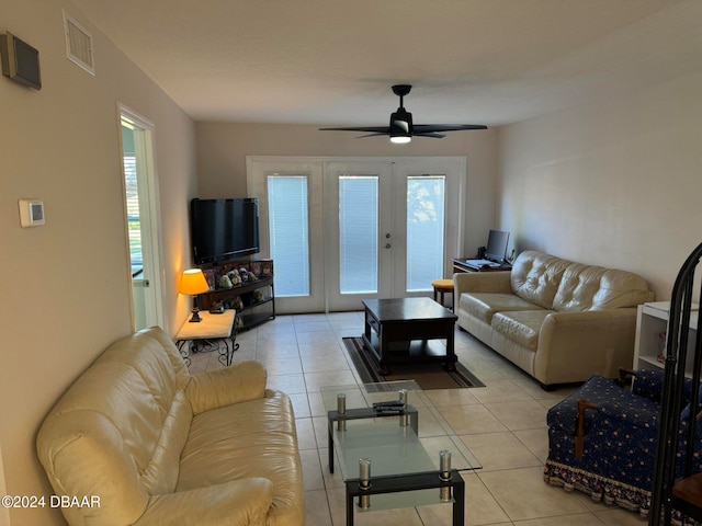 living room with ceiling fan, french doors, and light tile patterned floors