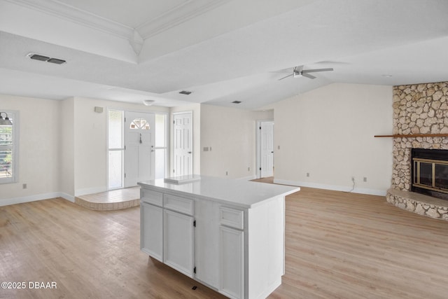 33 Sea Harbor Dr E, Ormond Beach, FL 32176 - kitchen featuring open floor plan, healthy amount of natural light, a ceiling fan, light wood-style floors, and ornamental molding