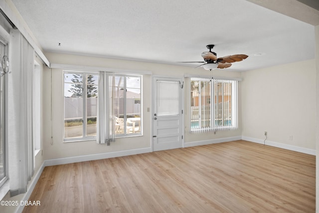 33 Sea Harbor Dr E, Ormond Beach, FL 32176 - spare room with baseboards, ceiling fan, and healthy amount of natural light