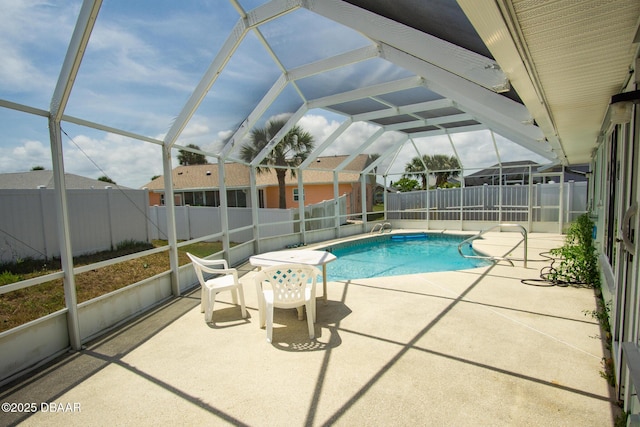 33 Sea Harbor Dr E, Ormond Beach, FL 32176 - view of swimming pool featuring a fenced backyard, a patio, and a lanai