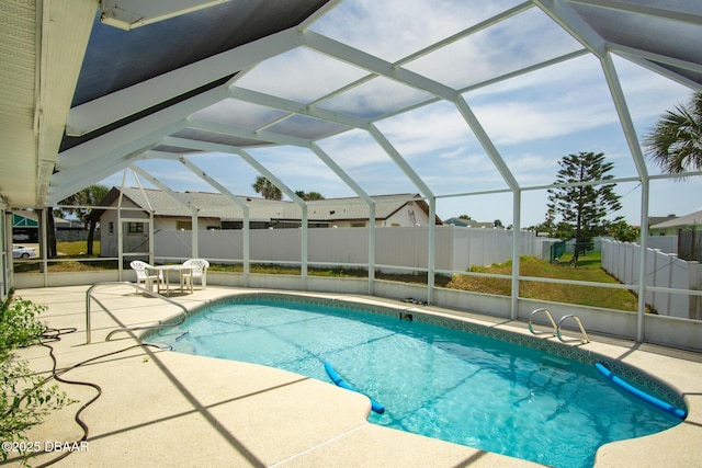 33 Sea Harbor Dr E, Ormond Beach, FL 32176 - view of swimming pool featuring a patio area, a lanai, and fence