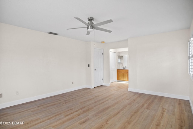 33 Sea Harbor Dr E, Ormond Beach, FL 32176 - spare room featuring light wood-style flooring, a ceiling fan, and baseboards