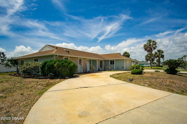 33 Sea Harbor Dr E, Ormond Beach, FL 32176 - ranch-style home with concrete driveway and a garage