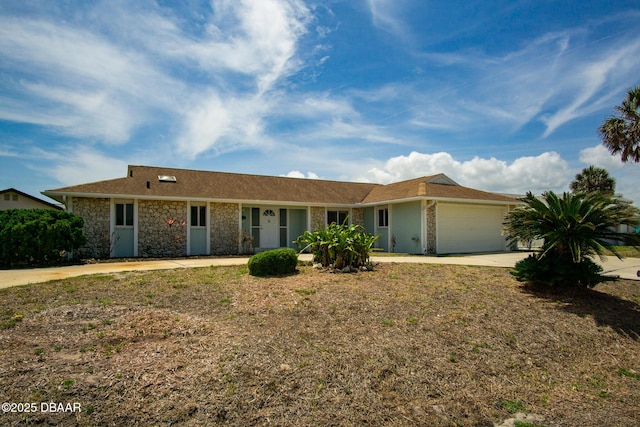 33 Sea Harbor Dr E, Ormond Beach, FL 32176 - ranch-style home featuring driveway, a garage, and stone siding
