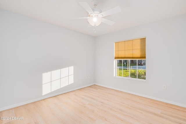 empty room featuring light hardwood / wood-style flooring and ceiling fan