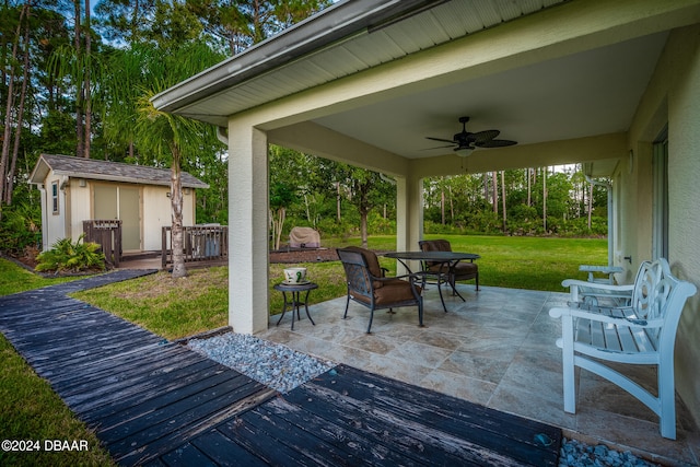 view of patio / terrace featuring a storage unit and ceiling fan