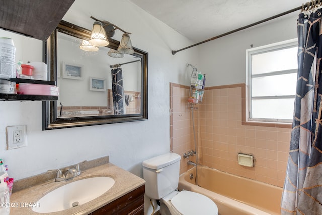 full bathroom featuring shower / tub combo with curtain, vanity, and toilet