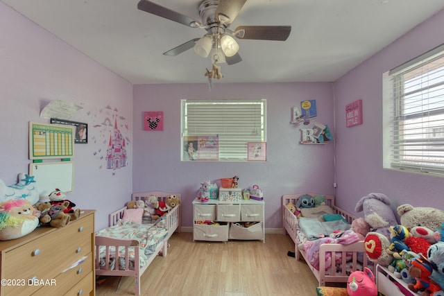 bedroom featuring light wood-type flooring and ceiling fan