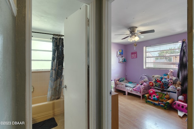 bedroom featuring light hardwood / wood-style floors and ceiling fan