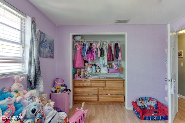 bedroom featuring a closet and light wood-type flooring