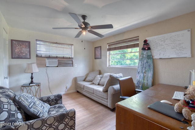 living room featuring ceiling fan and light hardwood / wood-style flooring