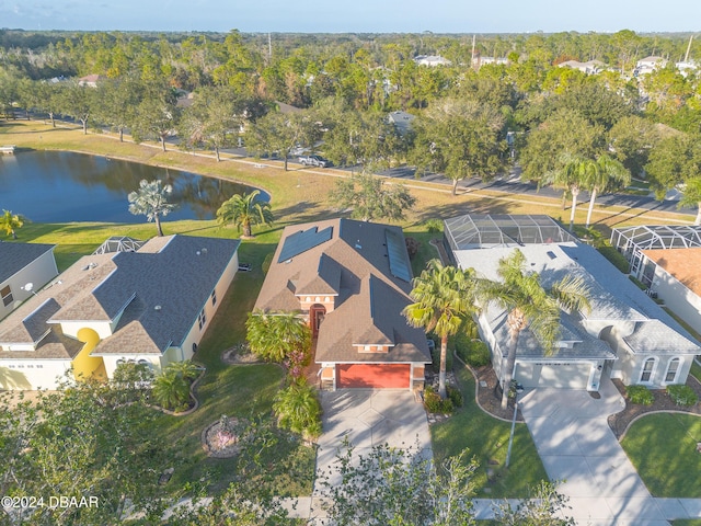 birds eye view of property with a water view