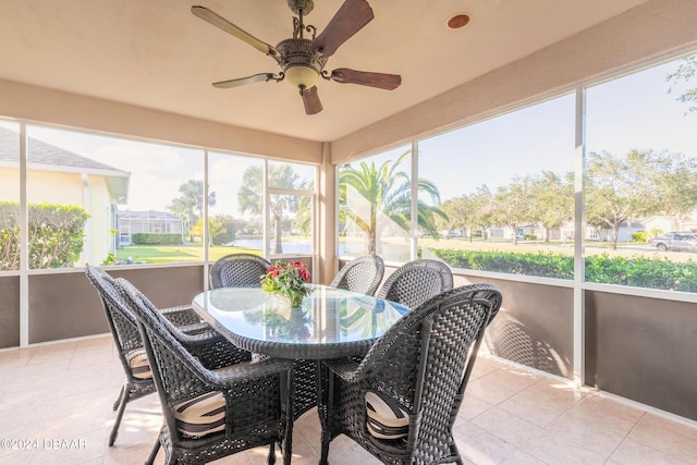 sunroom / solarium with ceiling fan