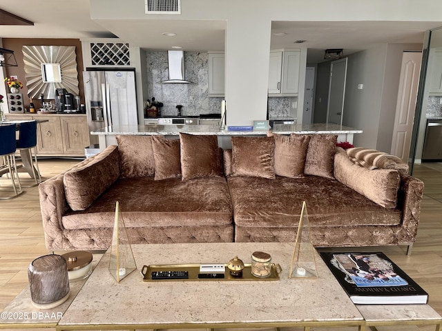 living room with light hardwood / wood-style flooring