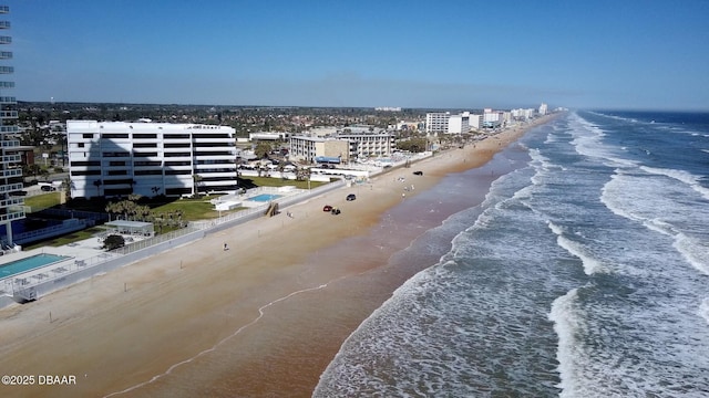 aerial view with a water view and a view of the beach