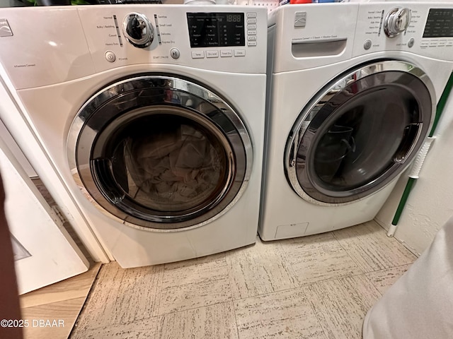 laundry room with washing machine and dryer