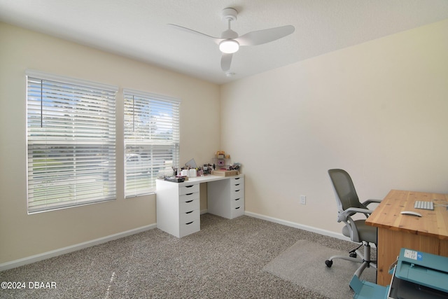 office space with ceiling fan and light colored carpet