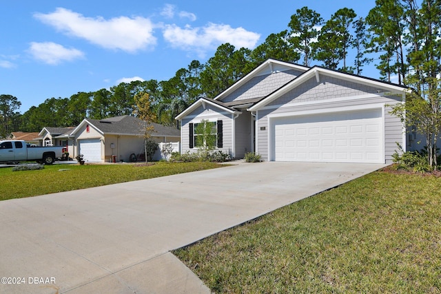 ranch-style house with a garage and a front lawn