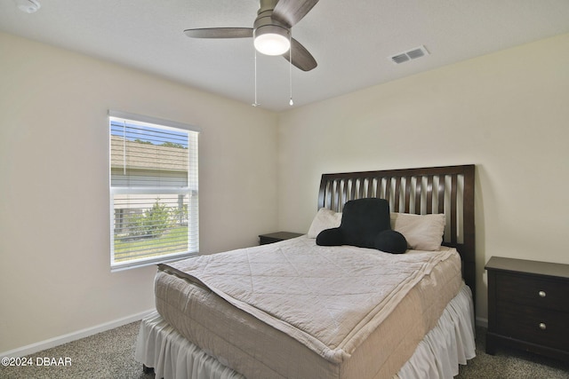 bedroom featuring carpet, multiple windows, and ceiling fan