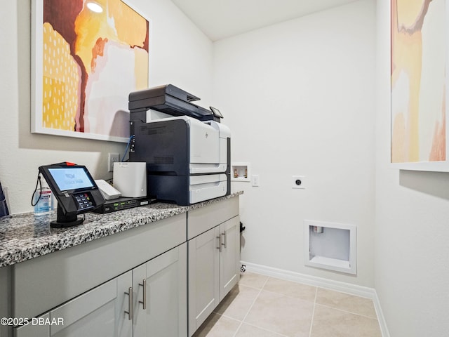 laundry room featuring light tile patterned floors, hookup for a washing machine, and electric dryer hookup