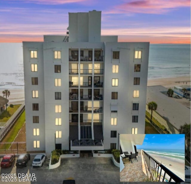2615 S Atlantic Ave Unit 7H, Daytona Beach, FL 32118 - property at dusk featuring view of water and beach and a view of apartment building / complex