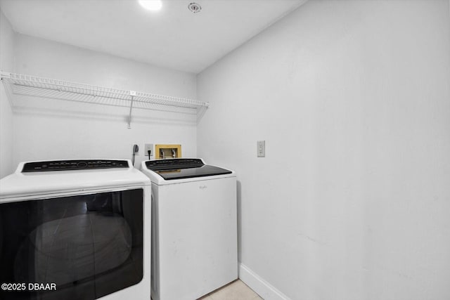 2615 S Atlantic Ave Unit 7H, Daytona Beach, FL 32118 - washroom featuring washer and dryer and baseboards