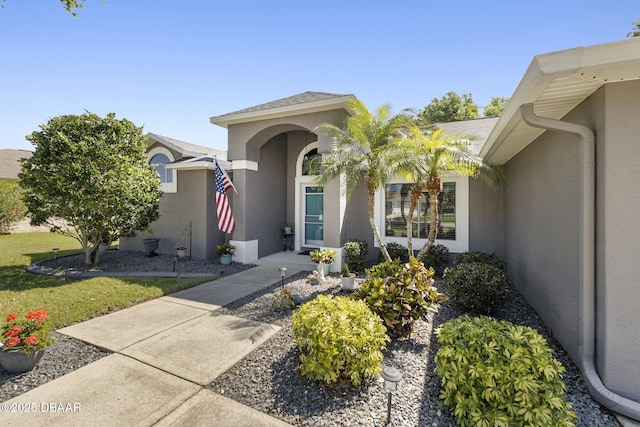 doorway to property with stucco siding