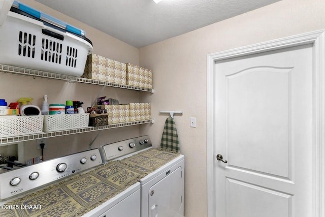 clothes washing area with laundry area and washing machine and clothes dryer