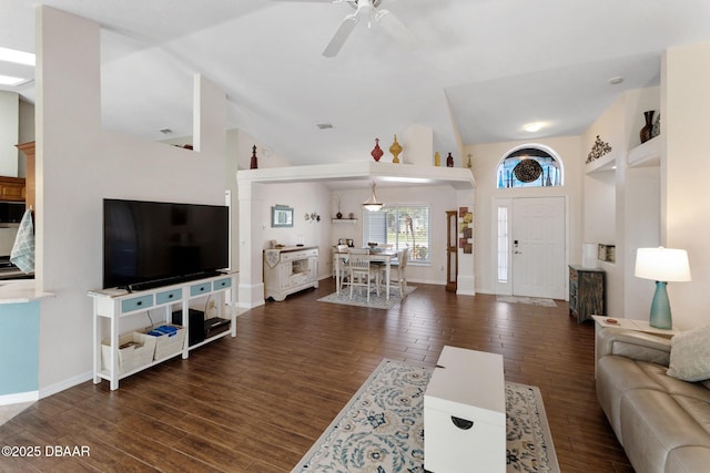 living area featuring wood finished floors, ceiling fan, and baseboards