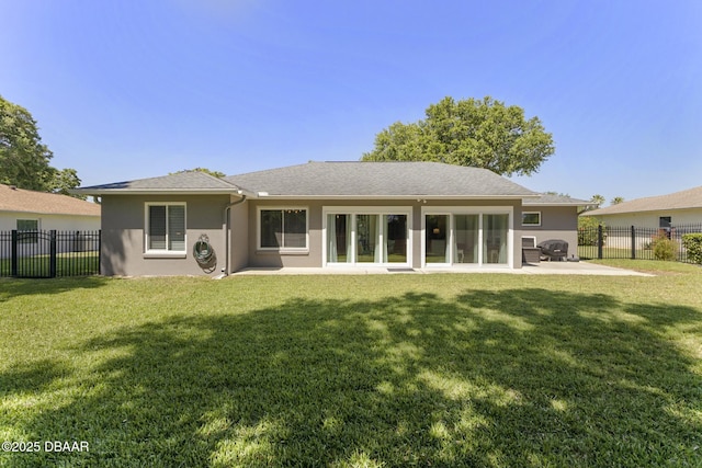 rear view of house featuring a fenced backyard, a patio, a lawn, and stucco siding