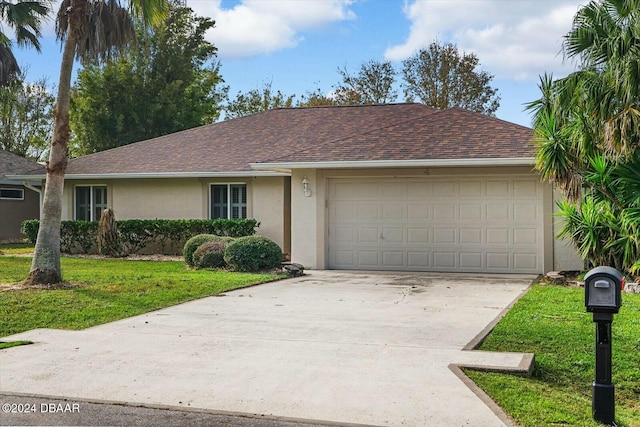 ranch-style house with a front yard and a garage