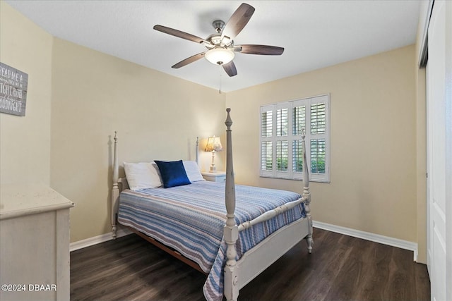 bedroom with ceiling fan and dark hardwood / wood-style flooring