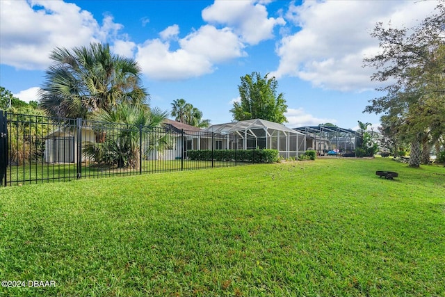 view of yard featuring a lanai